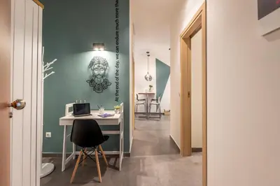 a room with a desk with a computer on a wall at Ports Crossroad A in Piraeus