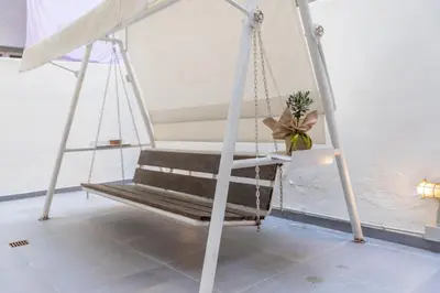a swing with a plant on it in a room at Ports Crossroad A in Piraeus