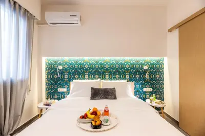 a bedroom with a bed with a tray of fruit on it at Ports Crossroad A in Piraeus