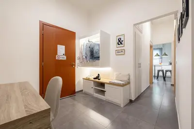 a room with a hallway with a table and a door at Ports Crossroad C in Piraeus