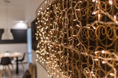 a bunch of christmas lights hanging on a wall at Ports Crossroad D in Piraeus