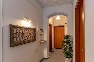 a hallway with a door and a potted plant at Ports Crossroad D in Piraeus