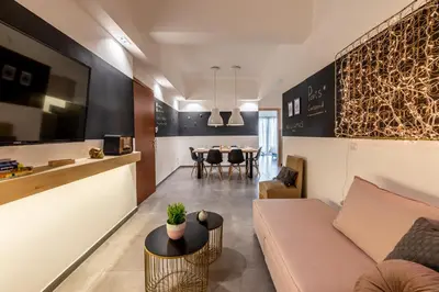 a living room with a couch and a table at Ports Crossroad D in Piraeus