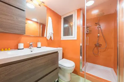 a bathroom with a toilet and a sink and a shower at Incredible Acropolis View Flat! in Athens