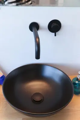 a black sink sitting on top of a counter at Triple A - Acropolis View in Psiri Athens - FREE Parking! in Athens