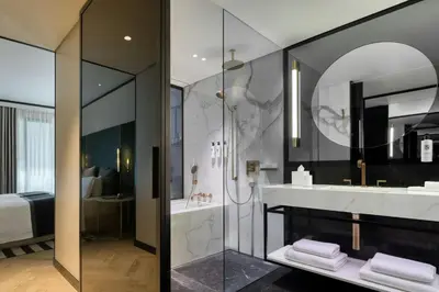 a bathroom with a shower and a sink at Academias Hotel, Autograph Collection in Athens
