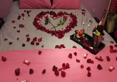 a bed with a heart made out of roses at Tonias house in Athens in Athens