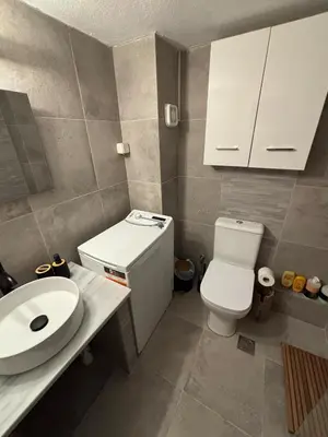 a small bathroom with a toilet and a sink at Katehaki Metro Flat in Athens