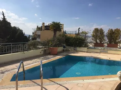 a swimming pool on top of a building at Luxury Penthouse with Private Roof Swimming Pool in Athens