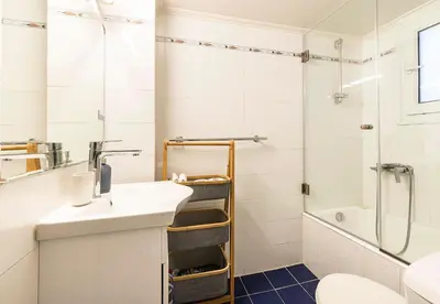 a bathroom with a sink and a shower at 1 KM from The Acropolis 1 Bedroom Apt in Athens