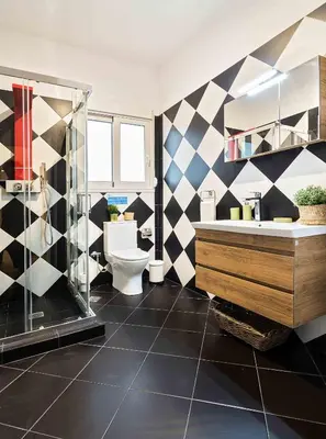 a bathroom with a black and white checkered wall at Athens' Top Location Romantic & Well Decor Shining Star in Athens