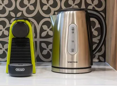 a coffee maker sitting on a counter next to a coffee pot at Athens' Top Location Romantic & Well Decor Shining Star in Athens