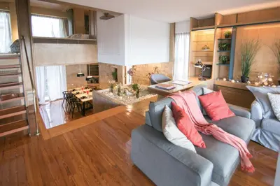 a living room with a couch and a dining room at One-of-a-kind Athens Riviera Apartment in Athens