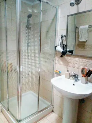 a bathroom with a shower and a sink at Φωτεινό διαμέρισμα Πειραιας in Piraeus