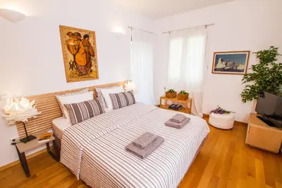 a bedroom with a bed with two towels on it at Athens luxurious apartment - sea view! in Athens