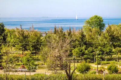 a view of the water and a sail boat at Athens luxurious apartment - sea view! in Athens