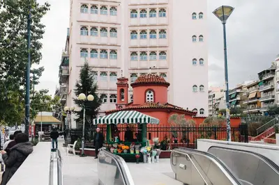 a building with a market in front of it at Manolitos Apartments 5 in Athens