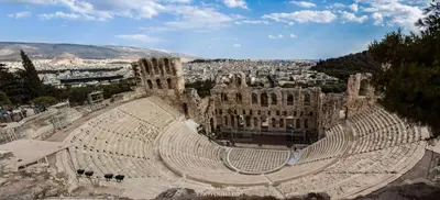 an empty amphitheater with a city in the background at Manolitos Apartments 5 in Athens