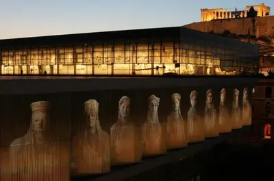 a row of white statues in front of a building at Manolitos Apartments 5 in Athens