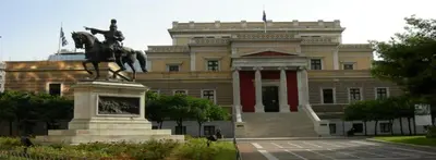 a large building with a statue in front of it at Manolitos Apartments 5 in Athens