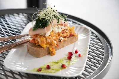 a white plate with a piece of food on it at 14 Reasons Why Hotel Athens in Athens