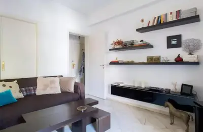 a living room with a couch and a table at At Trendy Glyfada's Center in Athens