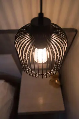 a black and white lamp sitting on top of a table at Wisdom Residence Luxury Apartments at Plaka in Athens
