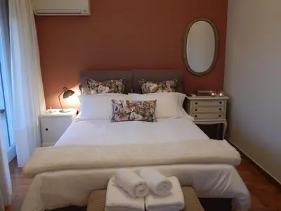 a bedroom with a large bed with towels on it at Athens-Plaka, Peter’s beautiful apartment in Temple of Zeus in Athens