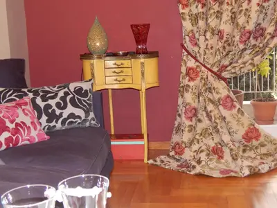 a living room with a couch and a table at Athens-Plaka, Peter’s beautiful apartment in Temple of Zeus in Athens