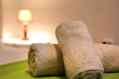 a wrapped up limb on a bed with a lamp at Aristotle's studio apartment in Athens