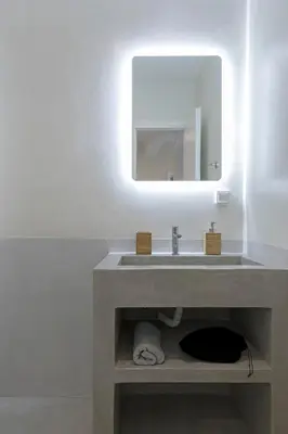 a bathroom with a sink and a mirror at Athenian Lofts in Athens
