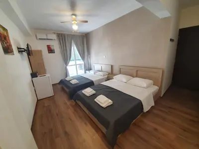 a bedroom with two beds and a window at City Centre Stylish rooms in Athens