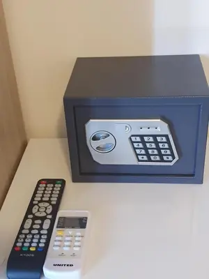 a box with two remotes and a remote control at City Centre Stylish rooms in Athens