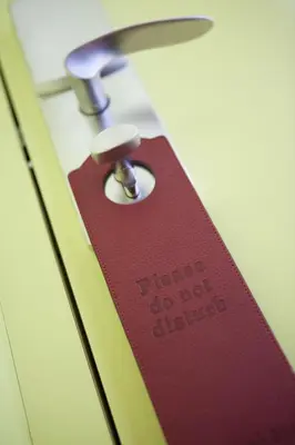 a red tag with the words fragile do not disturb at Athens Center Square Hotel in Athens