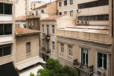 a group of tall buildings in a city at Ermou 44 - 3bdr Apartment in Athens
