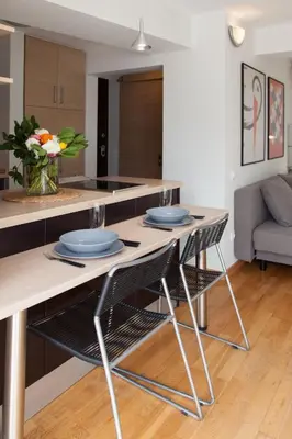 a kitchen with a table with blue plates on it at Homz AH02 Kolonaki Penthouse Studio in Athens