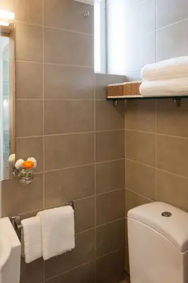 a bathroom with a toilet and a sink at Homz AH02 Kolonaki Penthouse Studio in Athens