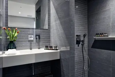 a bathroom with a sink and a shower at Athens4 in Athens