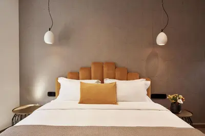 a bedroom with a large bed with white pillows at Athens4 in Athens