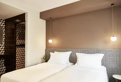 two beds sitting next to each other in a room at Athens4 in Athens