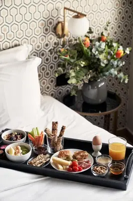 a tray of food on a bed with food on it at Athens4 in Athens