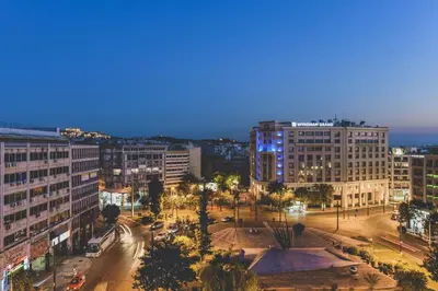 an aerial view of a city at night at Acropolis View - Living Stone Sapphire Apartment in Athens
