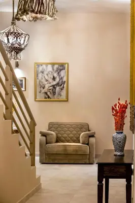 a living room with a couch and a table at Athens Manor Houses in Athens