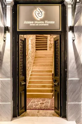 an entrance to an entrance to a building with stairs at Athens Manor Houses in Athens