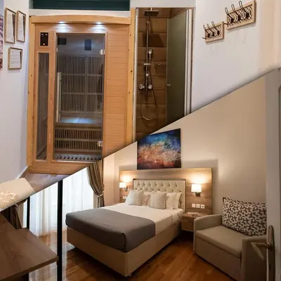 a bedroom with a bed and a stairway with a stair at Blue Ark Lavish Sauna Suite in Athens