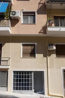 a building with a door and windows and a balcony at KYMA Apartments - Athens Acropolis 21 in Athens
