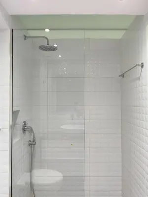 a shower with a glass door in a bathroom at KYMA Apartments - Athens Acropolis 21 in Athens