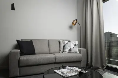a living room with a couch and a table at Azur Suites in Athens
