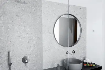 a bathroom with a sink and a mirror at Azur Suites in Athens