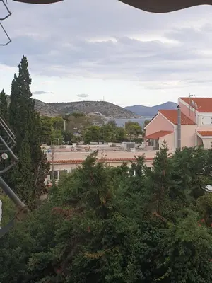 a view of a town with trees and buildings at Newly Renovated Varkiza Beachside One Bedroom with Large Terrace in Athens